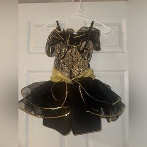 Costume Gallery black and gold dance costumes.